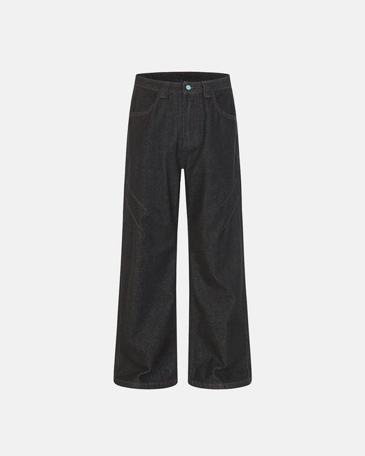 dark raw denim bootcut jeans with contrast stitching and deconstructed seam detail