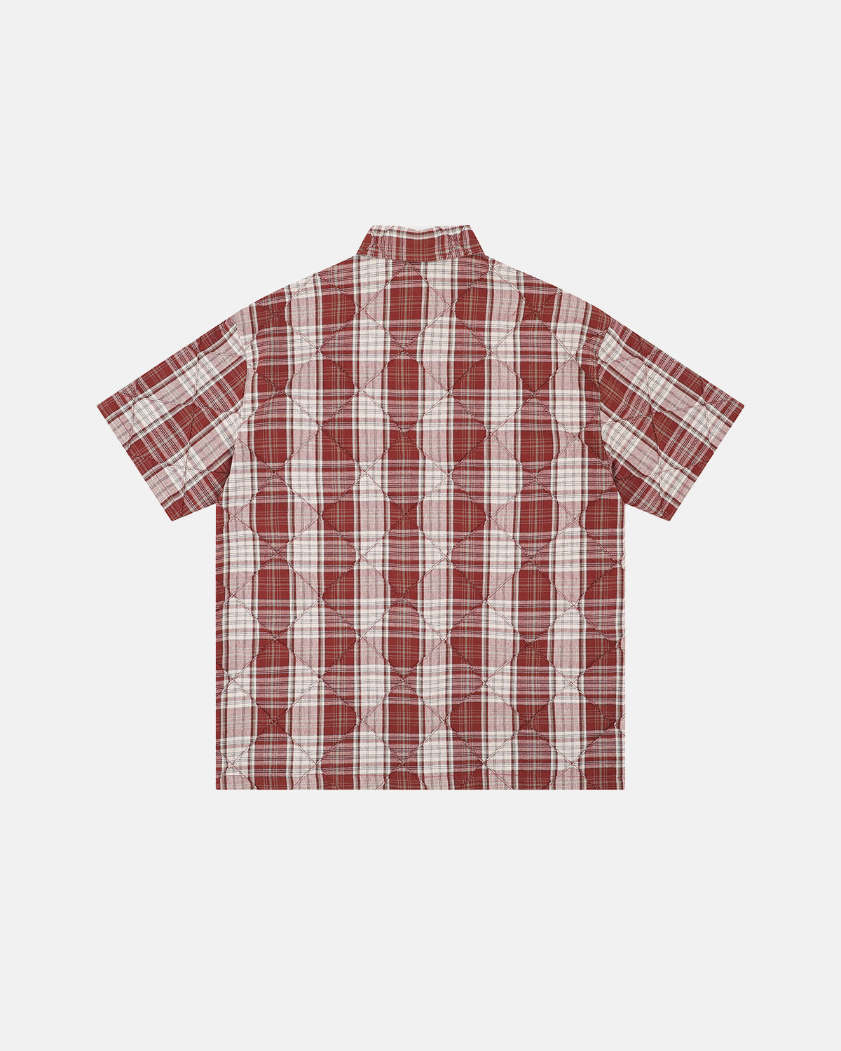 detail of stitched seam on plaid fabric